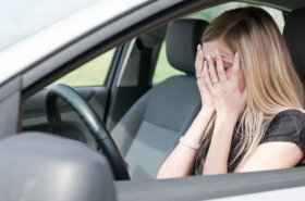 woman unsatisfied in car